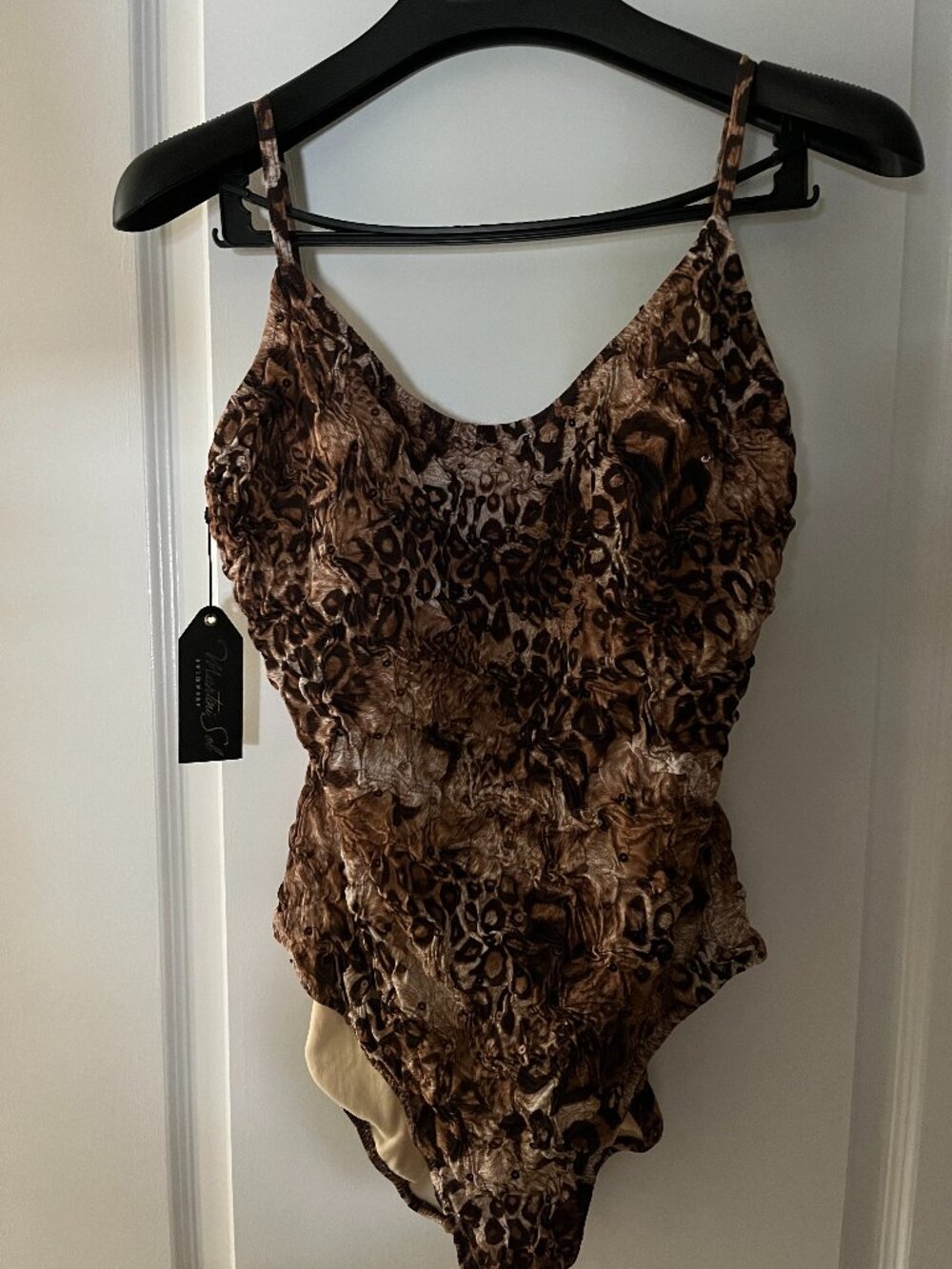 Animal print one piece bathing suit with sequins.